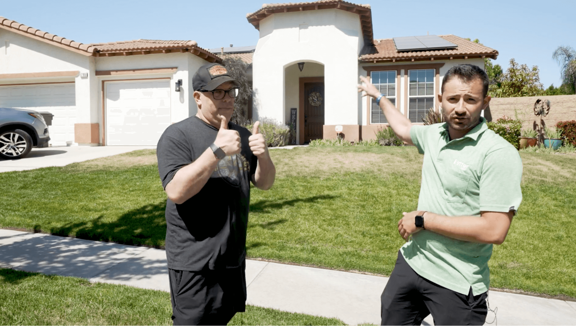 Satisfied homeowners celebrating solar installation